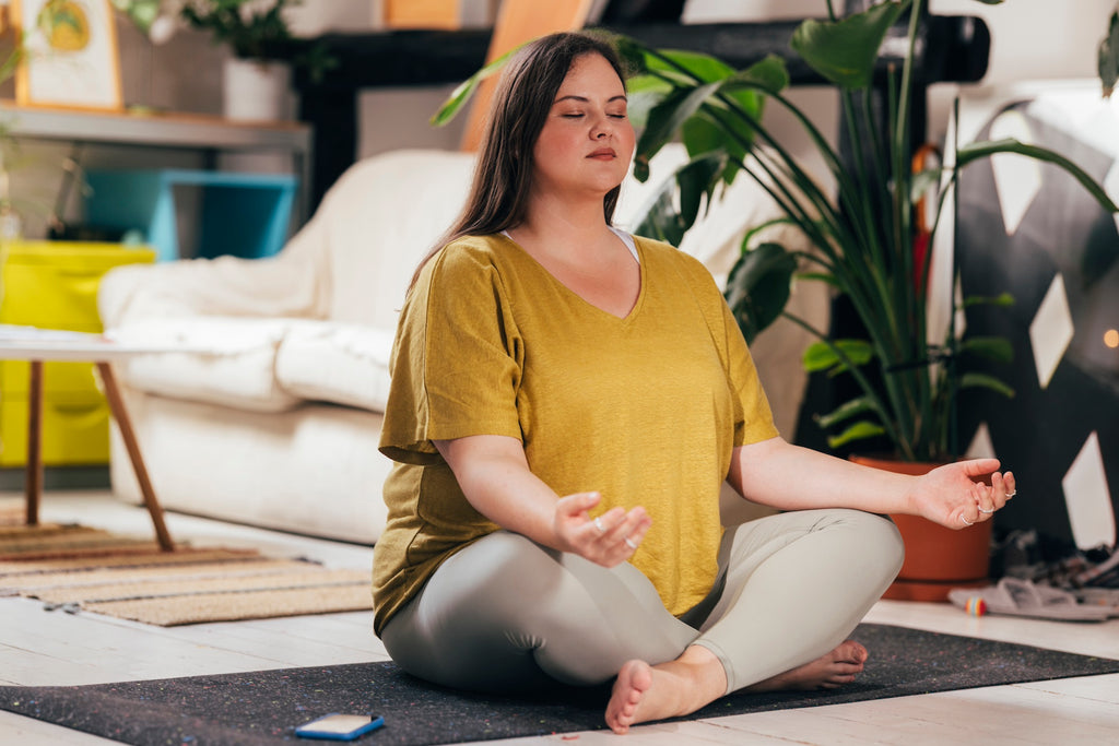 A close-up shot of someone meditating, focusing on their calm expression or relaxed posture.