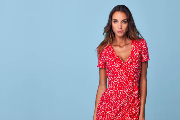 A vibrant summer dress featuring a flowing silhouette, lightweight fabric, and a floral pattern. Perfect for warm weather, offering comfort and style for casual outings or special occasions.